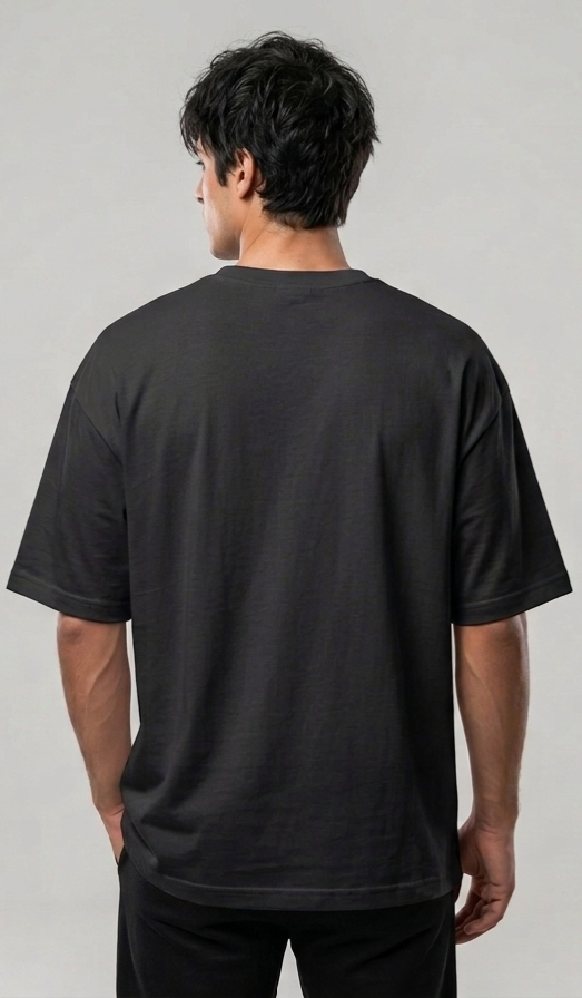 Black oversized unisex T-shirt worn by model, plain back