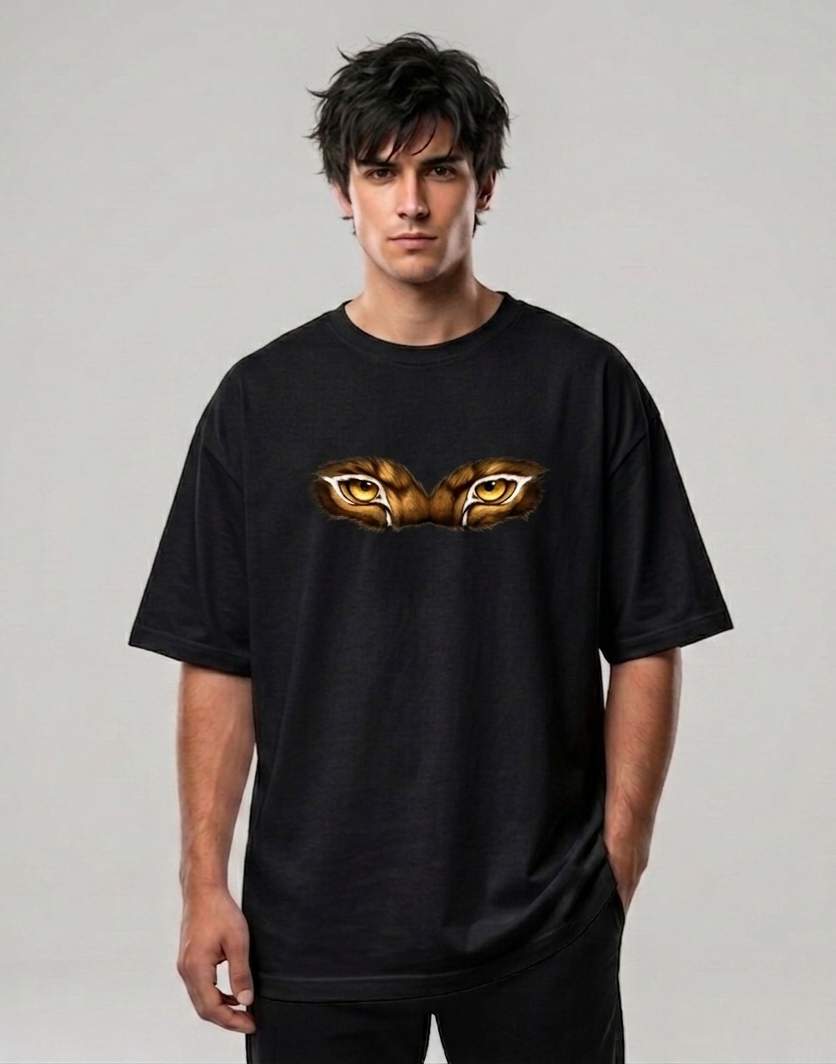 Black oversized T-shirt worn by model, tiger eyes graphic on chest.