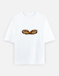 White oversized classic T-shirt with tiger eyes graphic on chest.